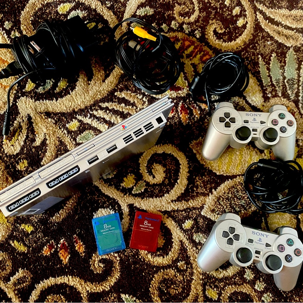 PlayStation 2 with 2 remotes, 2 8BG memory cards